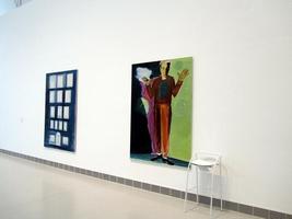 Painting of square blocks on left; painting of man standing with arms upraised on right.