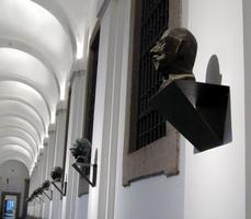 Row of sculptures of odd-looking heads