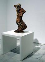 Abstract brown stone sculpture looking vaguely like two faces atop one another