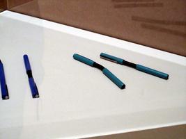 Ball-point pens with a bendable center section