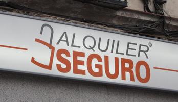 Sign for “Secure Rental” with a stylized padlock