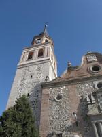 Steep upward view of church tower and body