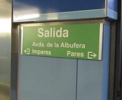 Subway directional sign pointing out which side of street has even and odd numbers