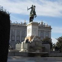 Statue of mounted rider in front of royal palace