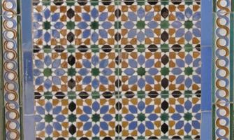 Geometric theme tiles at train station wall