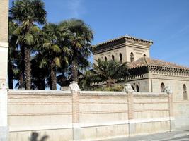 Palm trees and small building near train station