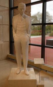 henry ford standing with hands in pockets