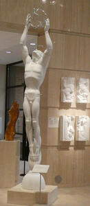 man holding wire sphere above head