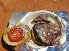 Portabello mushroom “burger” with grilled onions and tomato