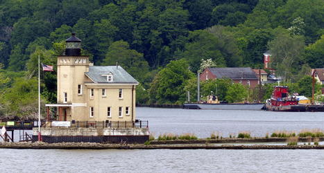 lighthouse with tug