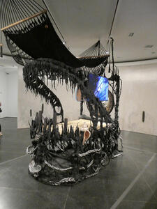 Black sculpture looking like the jaws of a dinosaur