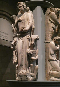 Sculpture of person holding book