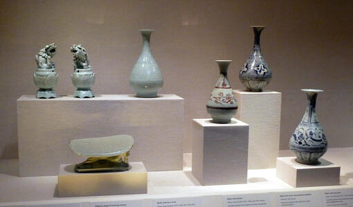 Earthenware incense burners in shape of animals and variety of bottles
