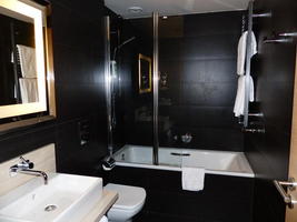 Bathroom with shower and sink.