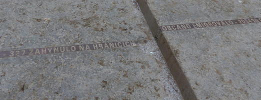 Engraved strip on steps telling number of victims