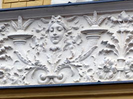 Relief work including an image of a young woman's face