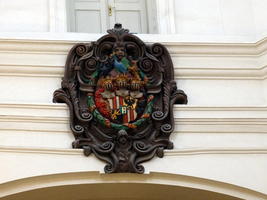 Royal-looking coat of arms near ceiling of main hall