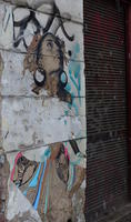Half-erased detailed drawing of woman on wall