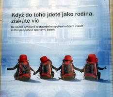 Backpacks wearing red hats, their straps posed like arms