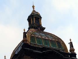 Rounded window with tower and spire