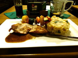 Chicken breast, skewered vegetables, and mashed potatoes.