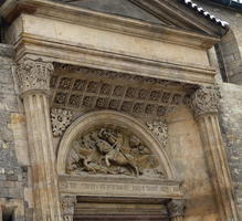 Exterior relief work under arch