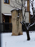 Abstract light stone sculpture in back yard of villa