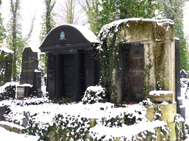 Large grave markers; one in old stone