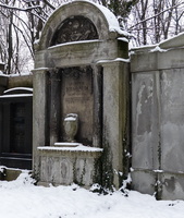 Marker with arched top and urn on a pedestal