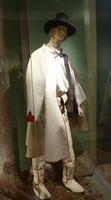 Man in white boots and cloak, black stovepipe hat