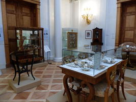 Aristocrat drawing room, silver dishware/utensils in foreground