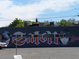 Wall of salon with detailed painted faces