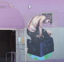 Wall painting of boy with book opened on head