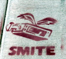 Winged box-like machine with subtitle “SMITE”