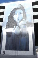Wall painting of woman in hood