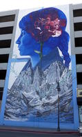 Wall painting of woman with mountains in foreground