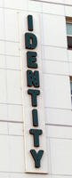 Building with IDENTITY in vertical lettering