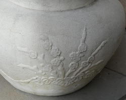 Flowers on white stone planter