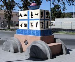 Scultpure with tiles showing people made of tangrams