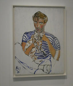 Man in blue striped shirt holding a cat