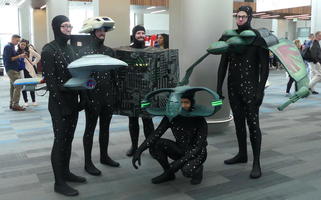 People dressed as Enterprise, shuttlecraft, borg cube, Romulan warbird, and Klingon cruiser