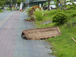 typhoon damaged thatched roof