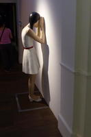 woman peering through window