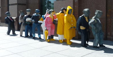 blocky statues people in line