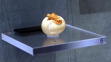 netsuke frog emerging from egg