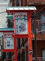 Old style Japanese artwork on signposts.