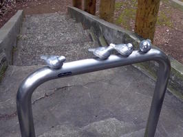 metal barricade with metal birds