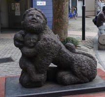 half-human, half-oriental-lion with child sculpture