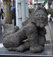 Oriental lion sculpture with human face