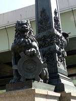 lion holding toothed wheel